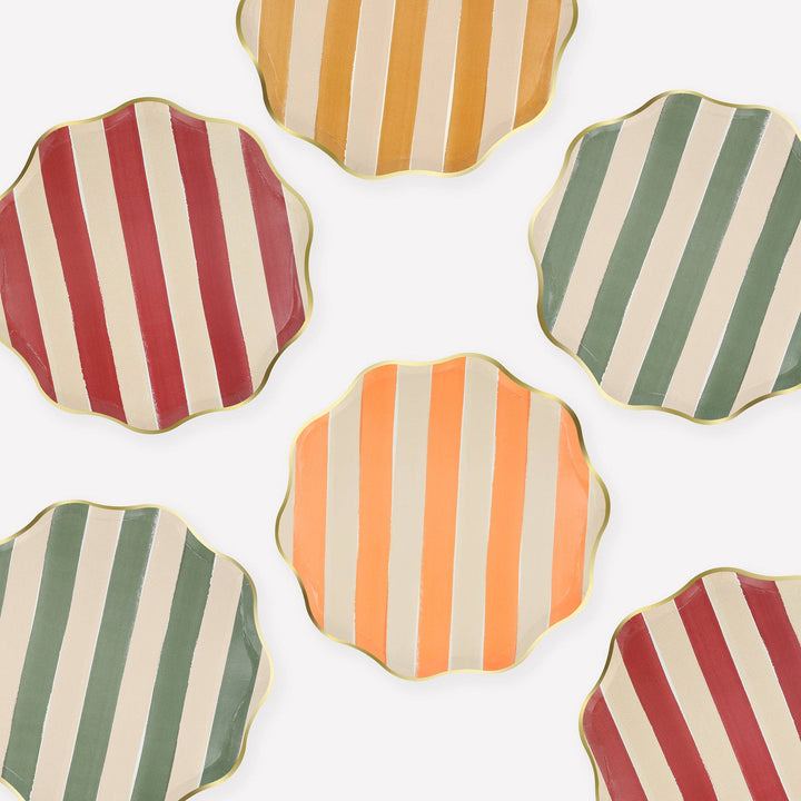 Hexagonal paper plates with striped patterns on a white background